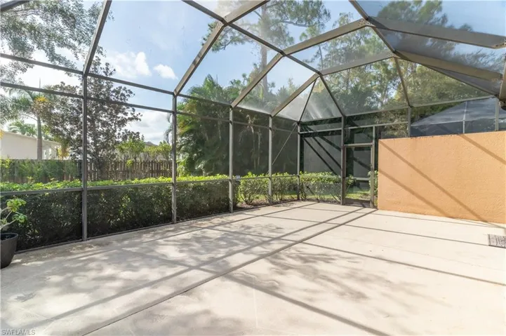 View of patio featuring a lanai and a sunroom