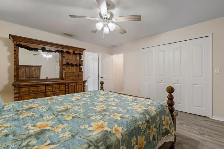 Master Bedroom with ceiling fan and hardwood / wood-style flooring