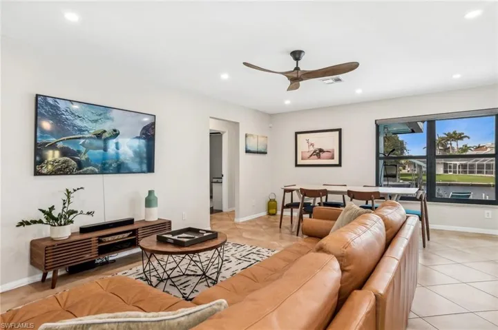 Tiled living room with ceiling fan