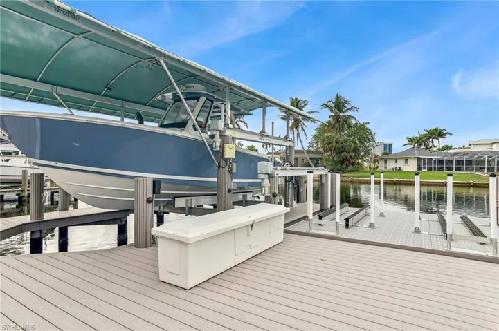 Dock area featuring a water view