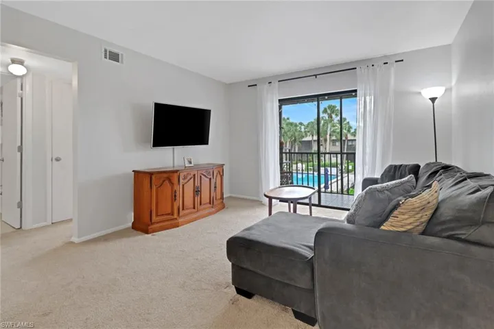 Living room with light colored carpet