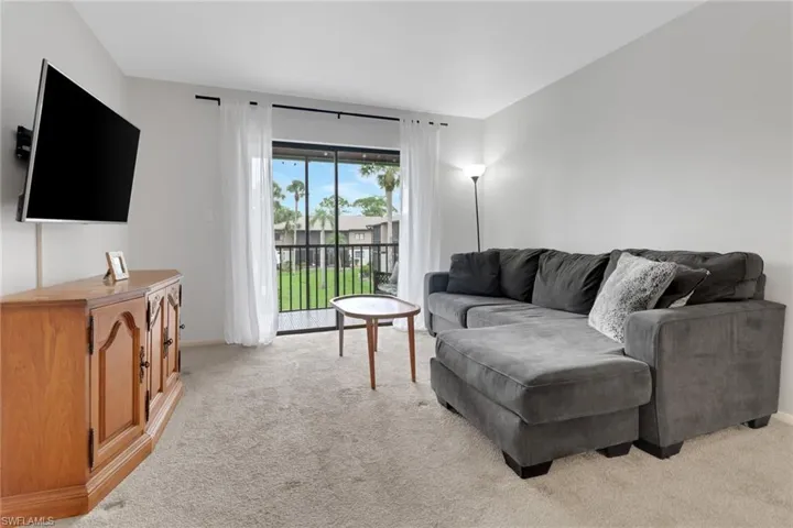 Living room with light colored carpet