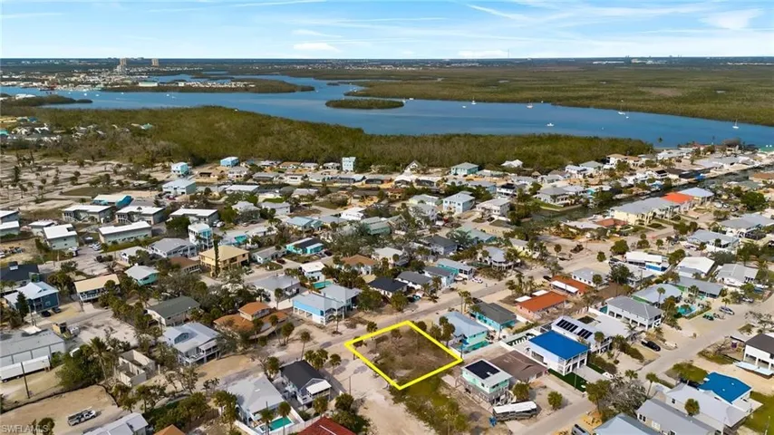 Drone / aerial view with a residential view and a water view - Virtually Edited Image