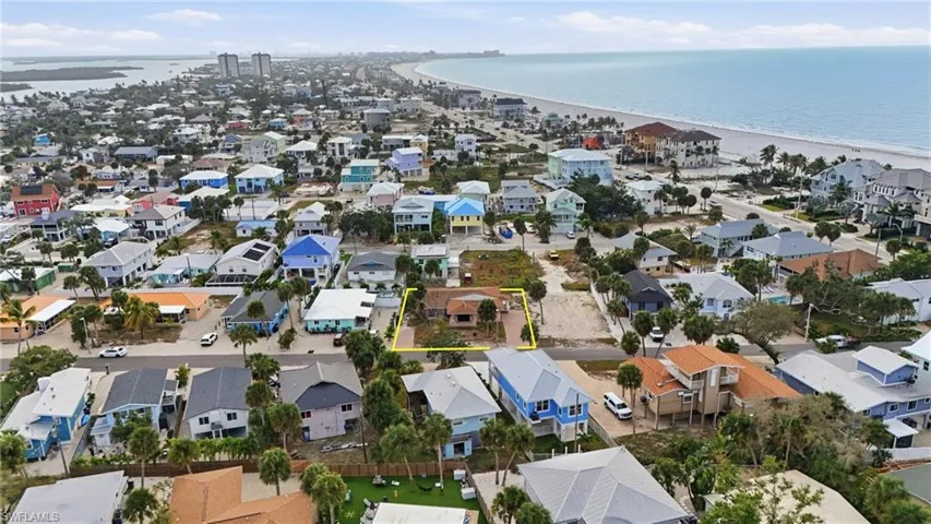 Aerial perspective of suburban area featuring a large body of water - Virtually Edited Image