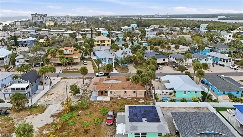 Aerial perspective of suburban area featuring a large body of water - Virtually Edited Image