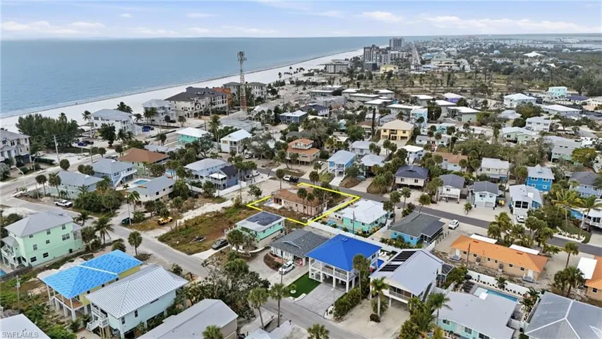 Aerial view of residential area with a large body of water - Virtually Edited Image