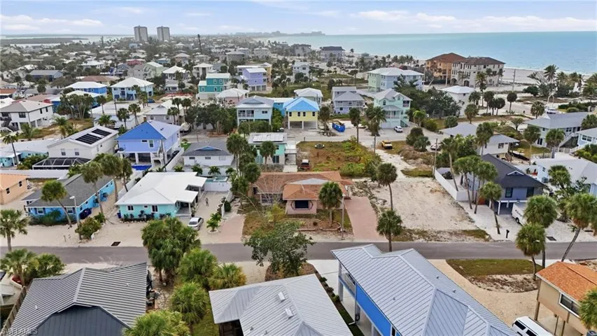 Aerial perspective of suburban area featuring a nearby body of water - Virtually Edited Image