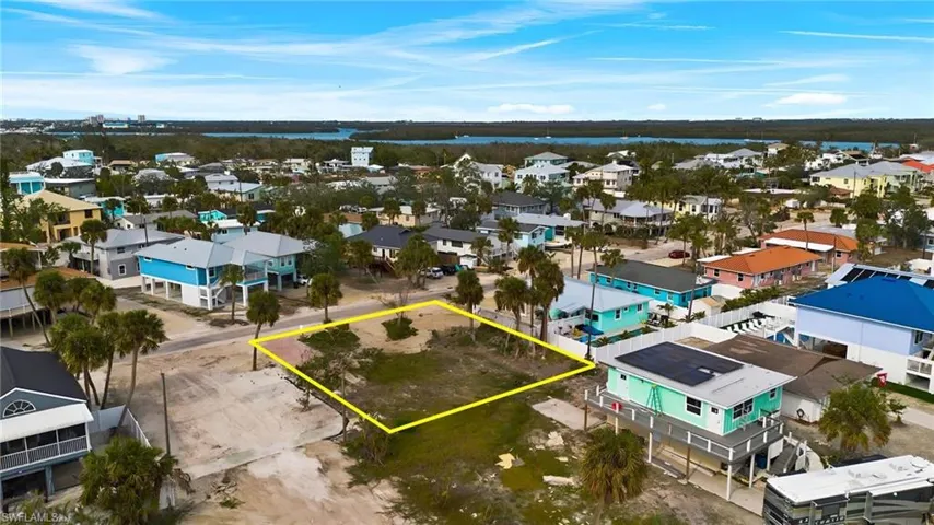Aerial view featuring a water view and a residential view - Virtually Edited Image