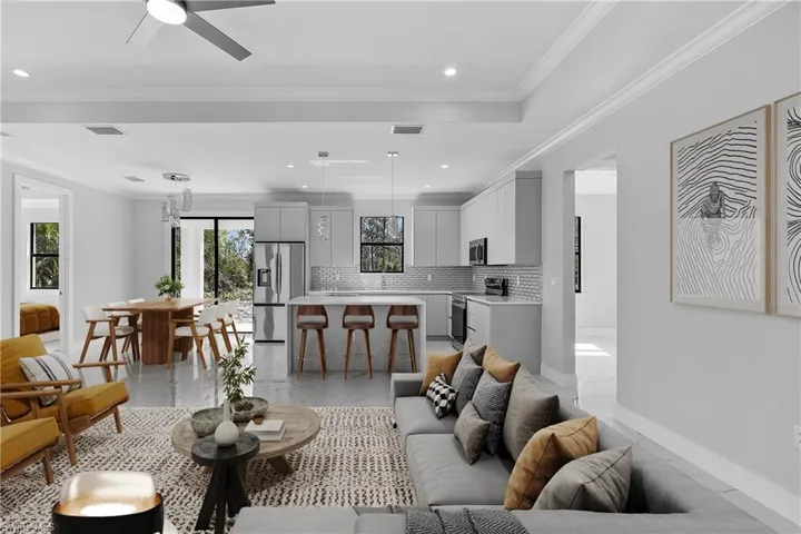 Open-concept living area featuring light wood-finish flooring throughout
