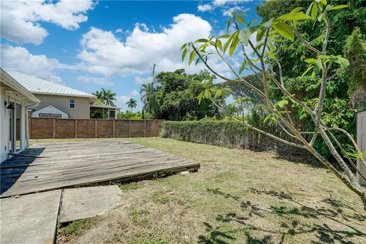 View of yard featuring a wooden deck