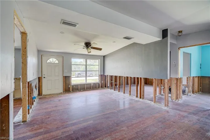 Foyer entrance featuring ceiling fan