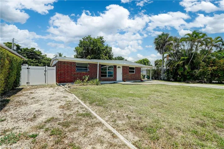 View of front of house with a front lawn