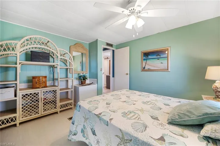 Bedroom with light wood finished floors and ceiling fan