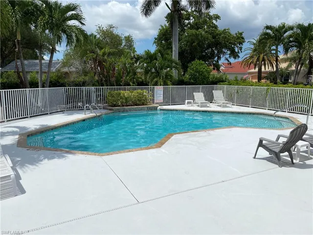 Community pool featuring a patio