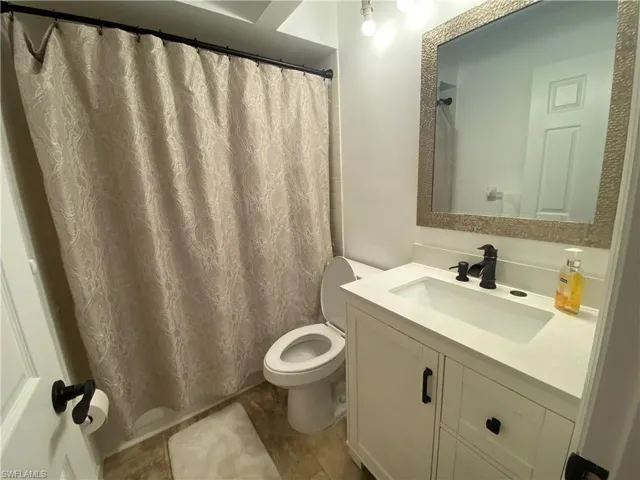 Bathroom with vanity and a shower with curtain