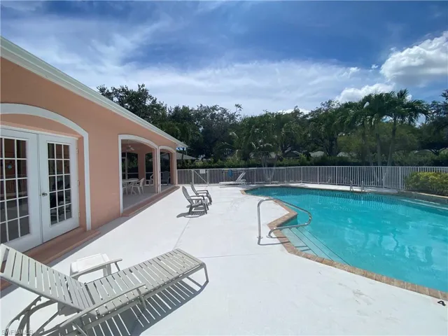 View of swimming pool featuring a patio area and french doors