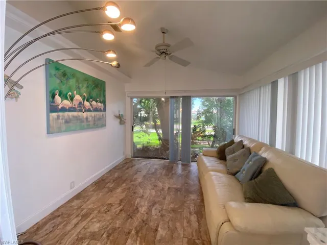 Sunroom / solarium featuring vaulted ceiling