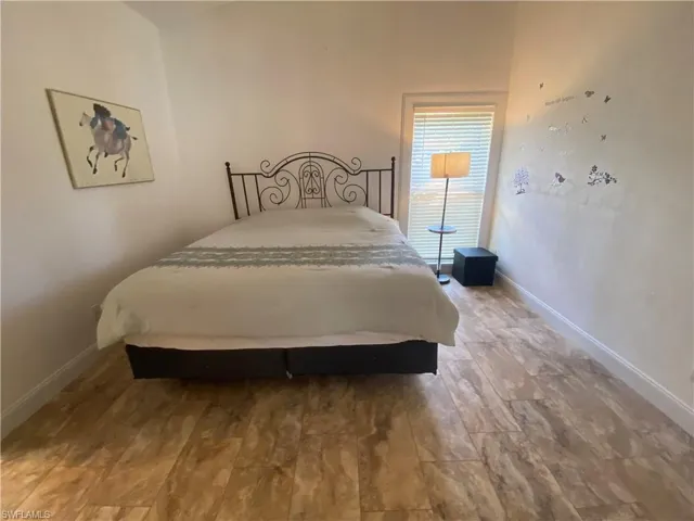 Bedroom with baseboards