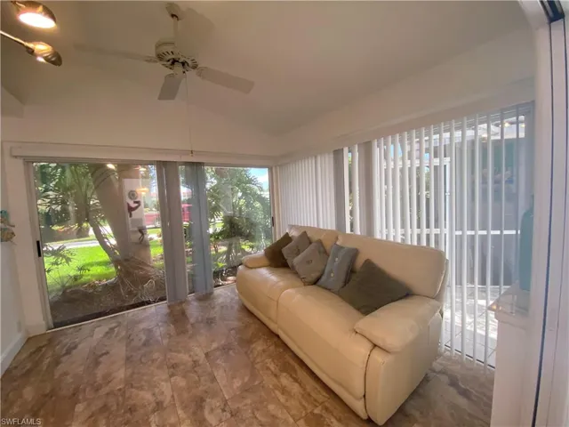 Sunroom with lofted ceiling and healthy amount of natural light