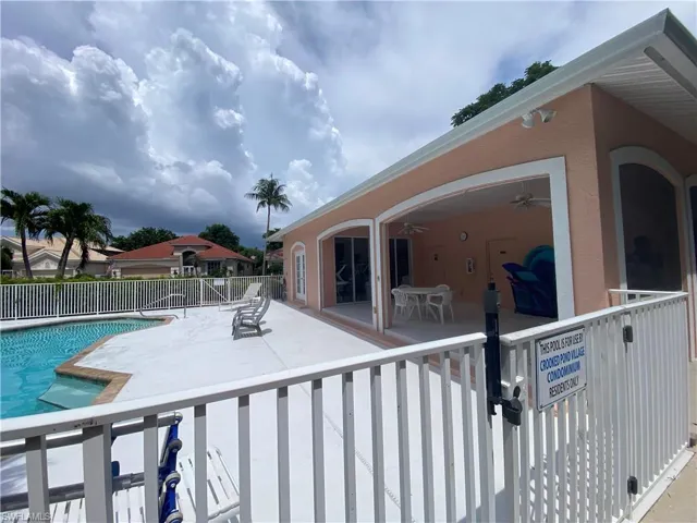 Community pool featuring a patio and ceiling fan