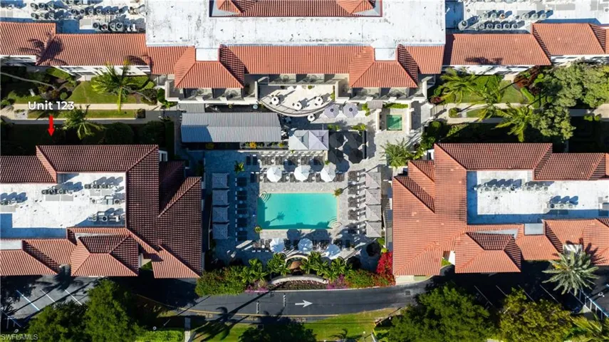 Aerial perspective of suburban area with a pool