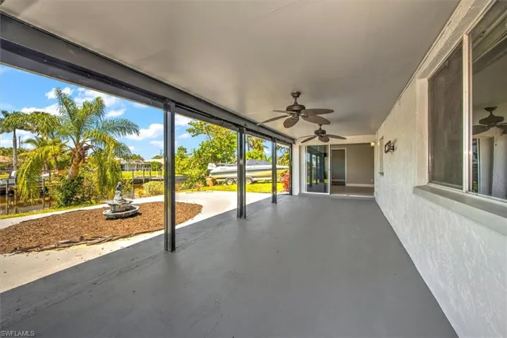 View of patio featuring ceiling fan