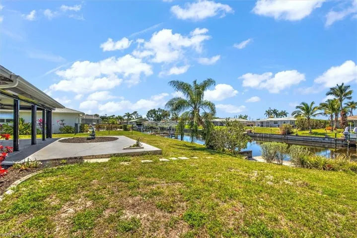 View of yard with a water view