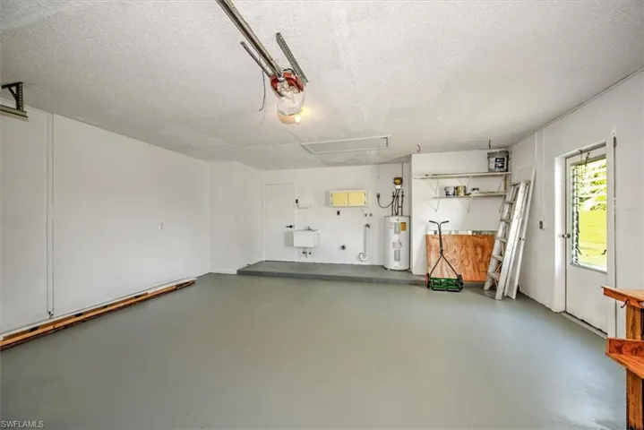 Garage featuring water heater
