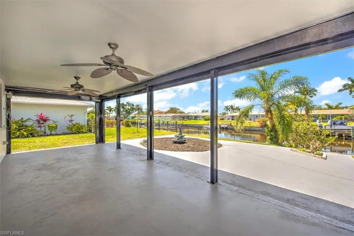View of patio / terrace featuring ceiling fan and a water view