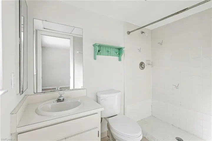 Bathroom featuring vanity and a stall shower