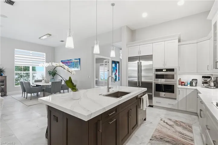 Central gathering island with pendant lighting and generous prep space.