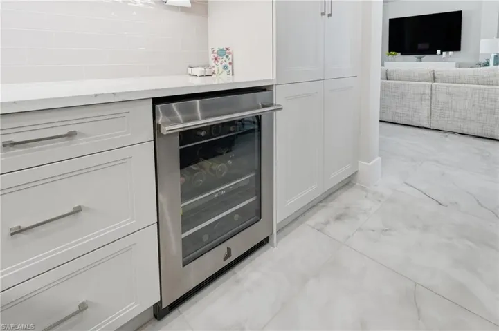 Built in wine cooler seamlessly integrated into the kitchen for effortless entertaining.