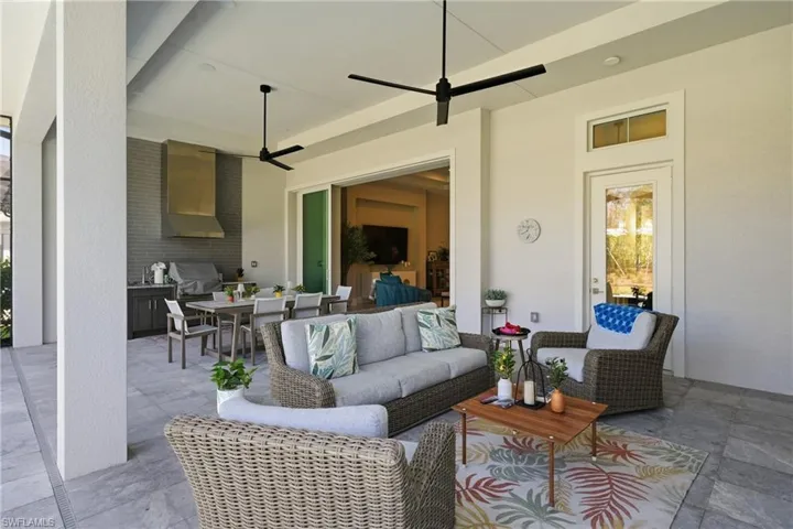 Seamless indoor outdoor living with pocketing sliders opening to nearly 600 square feet of covered lanai.