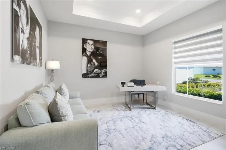 Private den with double doors, ideal for a home office, media room or optional fourth bedroom.
