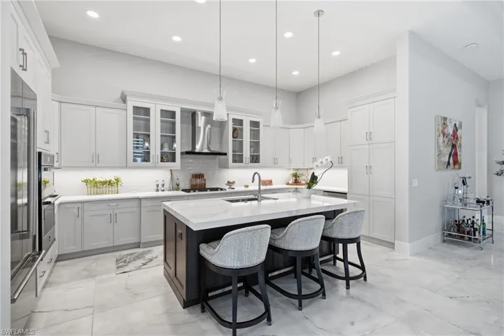 Oversized quartz island with bar seating, perfect for casual dining and entertaining.