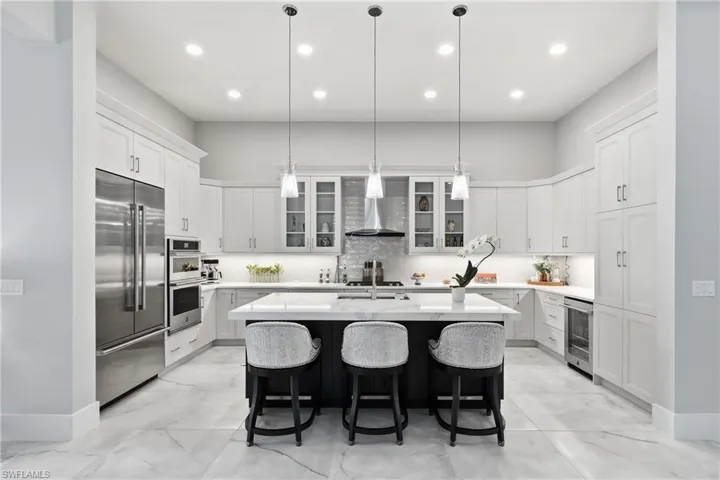 Spacious island kitchen designed for entertaining with ample prep space and seamless flow to the great room.