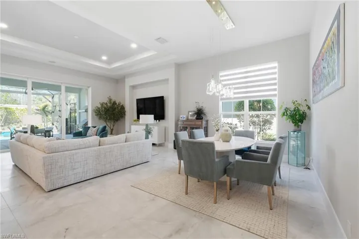Elegant great room designed for both entertaining and everyday comfort with preserve views beyond.