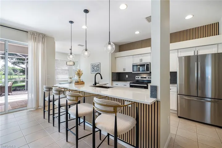 Gorgeous custom wood panels, upgrades lighting fixtures, and rich luxurious updates