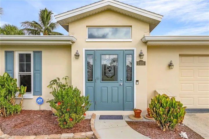 Entrance to property with a garage