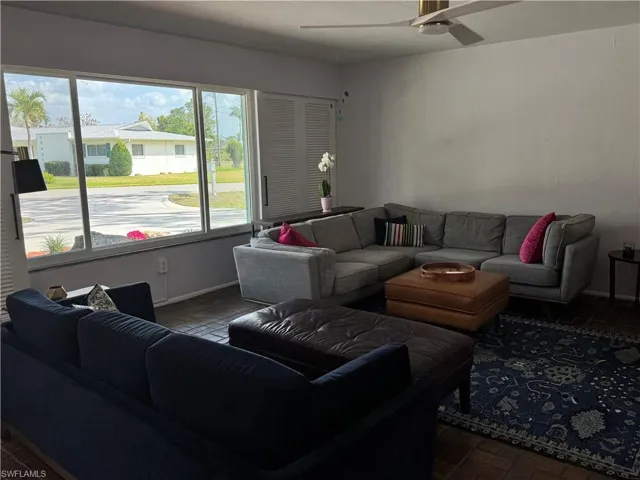 Living room featuring ceiling fan