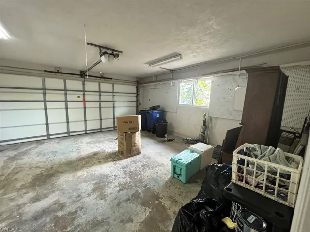 Garage featuring a garage door opener