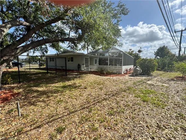 View of yard featuring fence