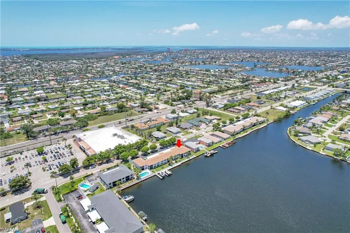 Aerial perspective of suburban area with a nearby body of water