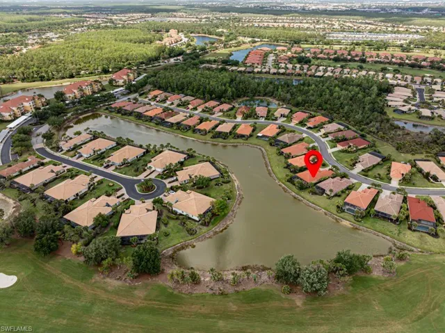 Aerial view featuring a water view and a residential view