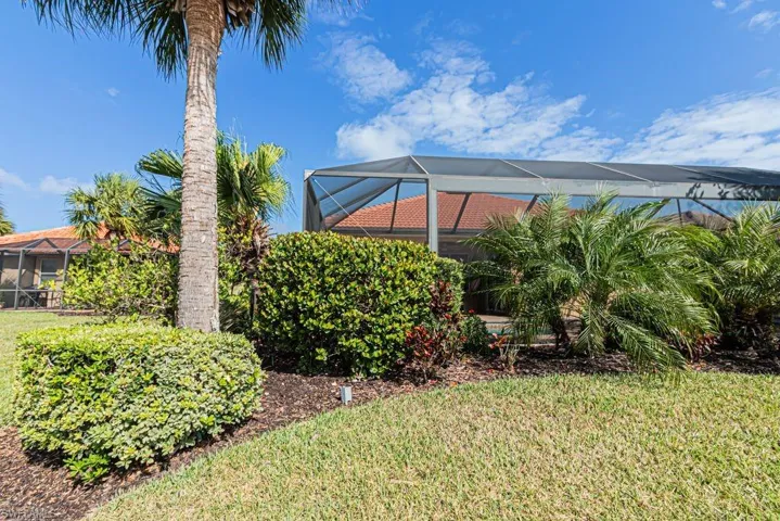View of yard with a lanai