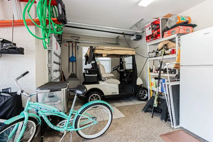 Garage with freestanding refrigerator