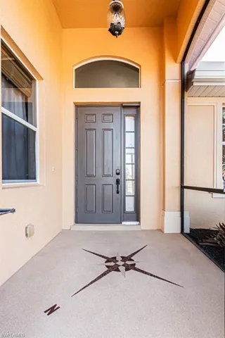 Entrance to property featuring stucco siding
