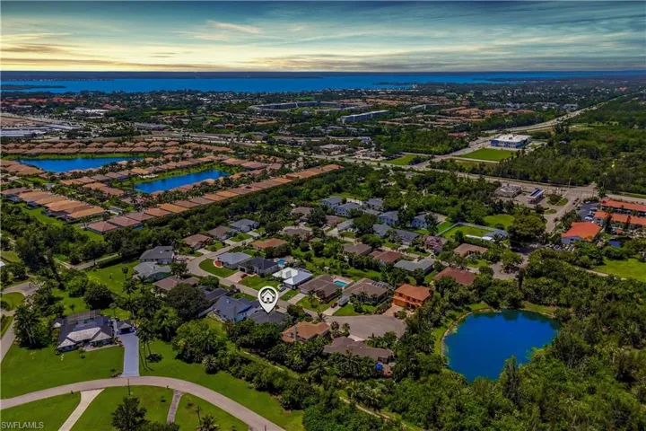Experience the location from above—this aerial view highlights the neighborhood charm and unbeatable South Fort Myers convenience.
