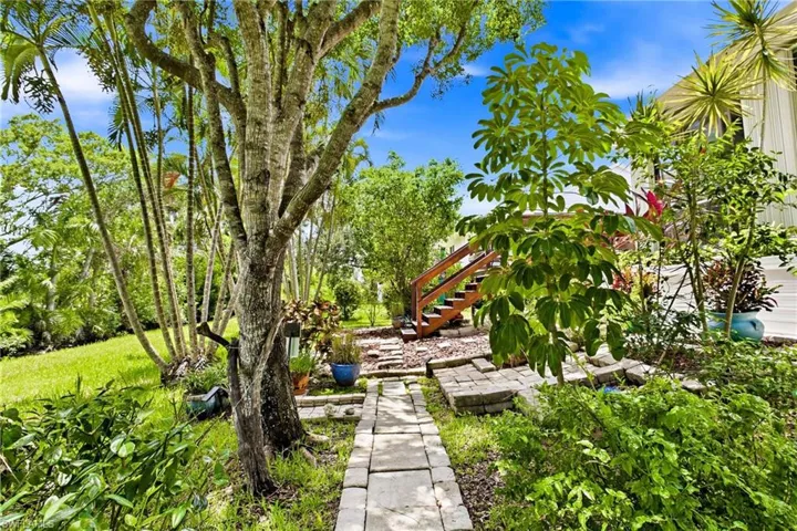 A true backyard haven with room to relax, entertain, garden, and enjoy year-round Southwest Florida living.