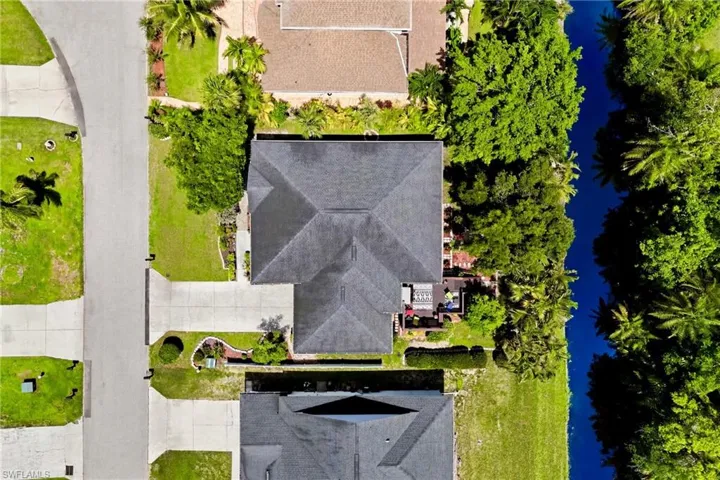 Aerial view showcasing the well-maintained roof and overall condition of this beautiful Southwest Florida home.